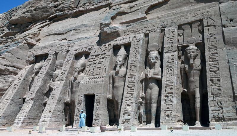 A guard at the temple of Queen Nefertari at Abu Simbel, Egypt. Tourism in Egypt was affected by the Covid-19 pandemic. EPA