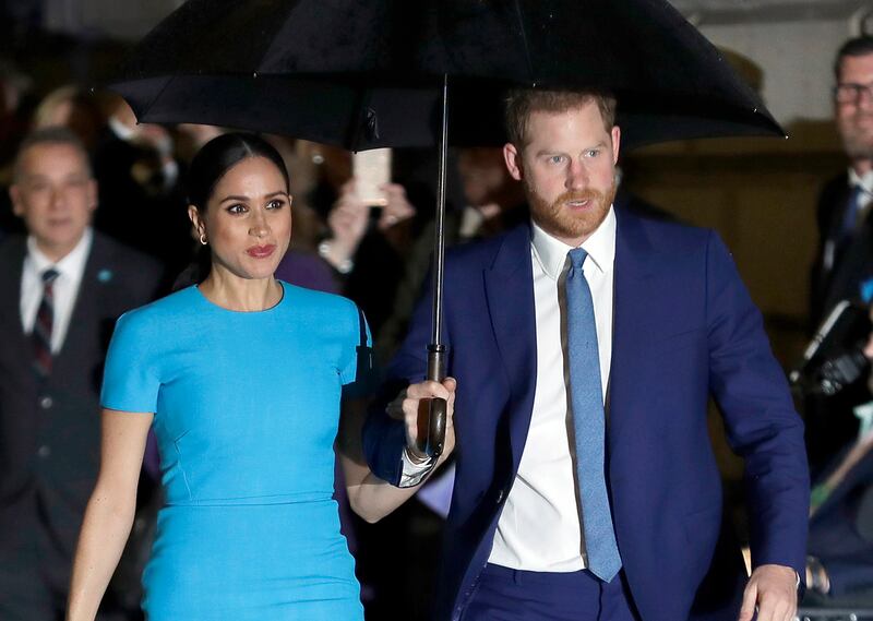 Harry, the Duke of Sussex and Meghan, the Duchess of Sussex, arrive at the annual Endeavour Fund Awards in London. AP