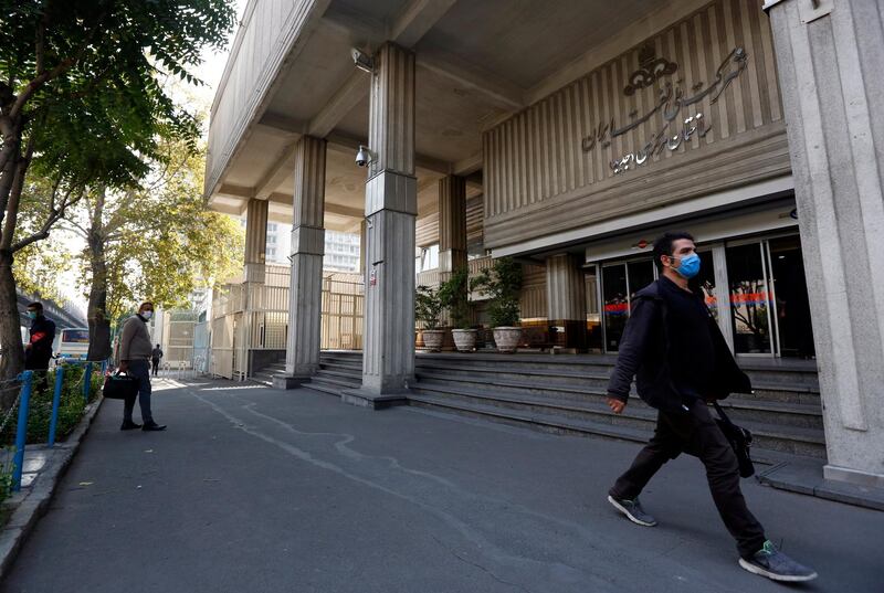 epa08777348 An Iranian man walks past Iranian oil ministry and industry complex department building in Tehran, Iran, 27 October 2020. Media reported that following tension between Iran and USA, the US administration announced more sanctions against the country which mostly targets Iranian oil industries causing severe damage to the Iranian economy as Iran is in high economic crisis.  EPA/ABEDIN TAHERKENAREH