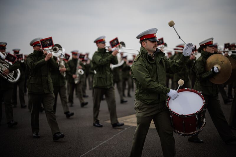 The Band of His Majesty's Royal Marines from Portsmouth ensure it's in tune for the coronation procession. Getty