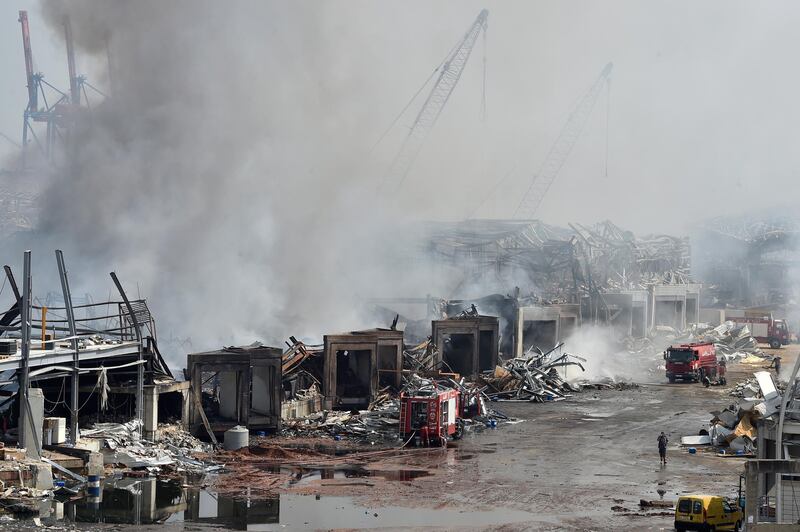 Firefighters extinguish a fire in a warehouse at the port of Beirut. EPA