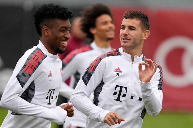 Bayern Munich's Lucas Hernandez, right, gestures besides his teammate Kingsley Coman. AP Photo / Matthias Schrader