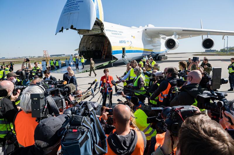 German Defense Minister Annegret Kramp-Karrenbauer (C) speaks with the media near a shipment of 10 million protective face masks and other protective medical gear that had arrived on an Antonov 225 cargo plane from China at Leipzig/Halle Airport during the novel coronavirus crisis in Schkeuditz, Germany. The flight, coordinated by the Bundeswehr, the German armed forces, is one of three that will bring 25 million masks to Germany. Germany currently has approximately 157,000 confirmed cases of Covid-19 infection, of which approximately 103,000 have recovered and 6,0000 have died. Getty