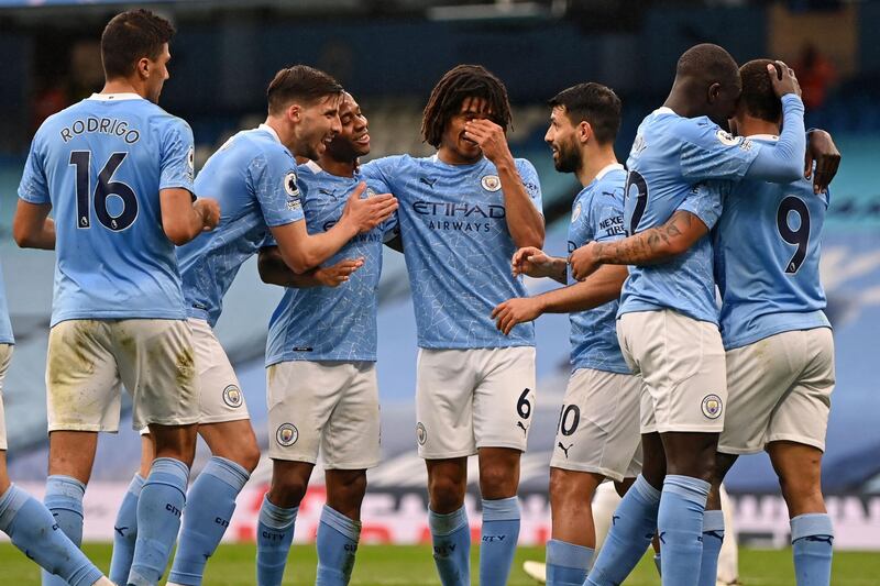 Manchester City's English midfielder Raheem Sterling (3rd L) celebrates with teammates after scoring the opening goal of the English Premier League football match between Manchester City and Chelsea at the Etihad Stadium in Manchester, north west England, on May 8, 2021. RESTRICTED TO EDITORIAL USE. No use with unauthorized audio, video, data, fixture lists, club/league logos or 'live' services. Online in-match use limited to 120 images. An additional 40 images may be used in extra time. No video emulation. Social media in-match use limited to 120 images. An additional 40 images may be used in extra time. No use in betting publications, games or single club/league/player publications.
 / AFP / POOL / Shaun Botterill / RESTRICTED TO EDITORIAL USE. No use with unauthorized audio, video, data, fixture lists, club/league logos or 'live' services. Online in-match use limited to 120 images. An additional 40 images may be used in extra time. No video emulation. Social media in-match use limited to 120 images. An additional 40 images may be used in extra time. No use in betting publications, games or single club/league/player publications.
