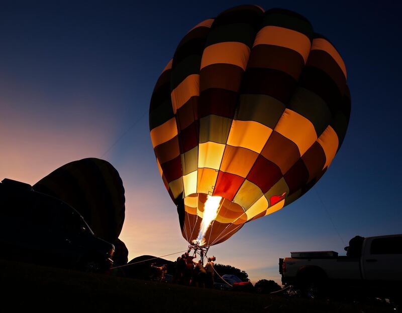 People try to get their hot air balloons up in the wind during the Lions Balloon Festival in Highland Village, Texas.  EPA