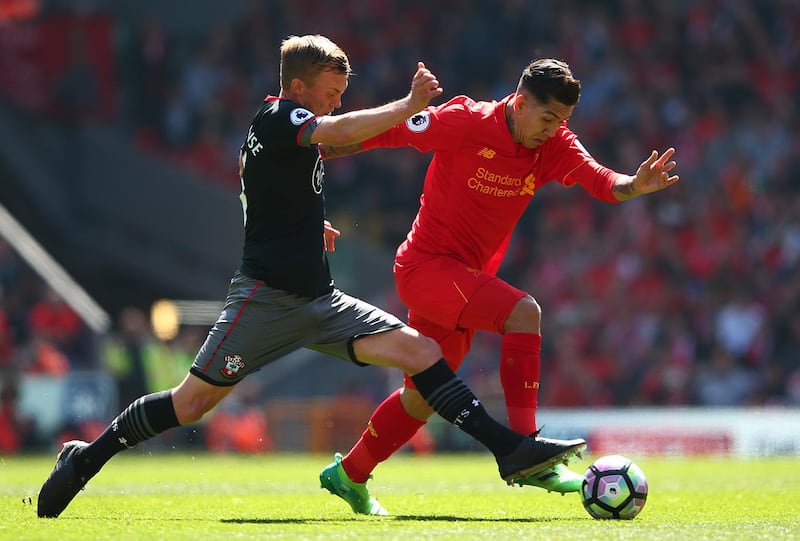 LIVERPOOL, ENGLAND - MAY 07: James Ward-Prowse of Southampton tackles Roberto Firmino of Liverpool during the Premier League match between Liverpool and Southampton at Anfield on May 7, 2017 in Liverpool, England.  (Photo by Alex Livesey/Getty Images)