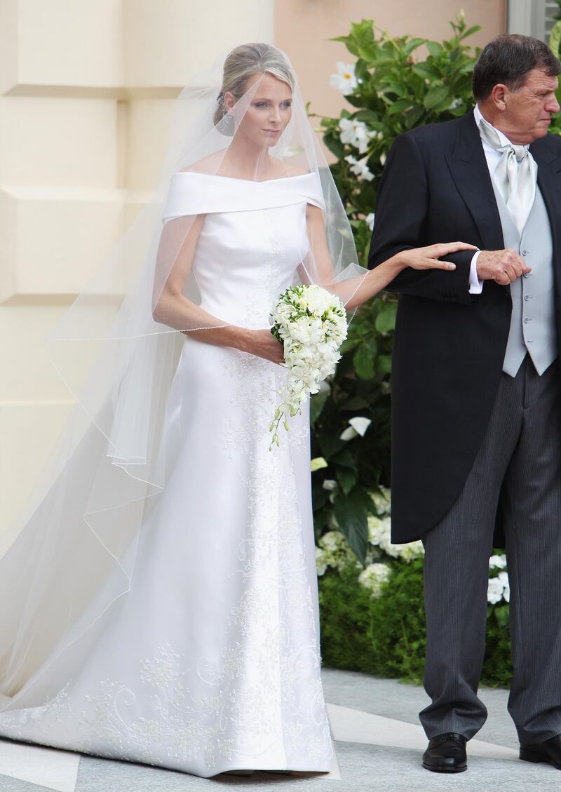 MONACO - JULY 02:  Princess Charlene of Monaco attends her religious ceremony of the Royal Wedding to husband Prince Albert II of Monaco in the main courtyard at the Prince's Palace on July 2, 2011 in Monaco. The Roman-Catholic ceremony follows the civil wedding which was held in the Throne Room of the Prince's Palace of Monaco on July 1. With her marriage to the head of state of the Principality of Monaco, Charlene Wittstock has become Princess consort of Monaco and gains the title, Princess Charlene of Monaco. Celebrations including concerts and firework displays are being held across several days, attended by a guest list of global celebrities and heads of state.  (Photo by Dan Kitwood/Getty Images) 