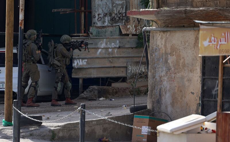 Israeli troops look for people suspected of involvement in the shooting, which occurred in a busy nightlife district. AFP