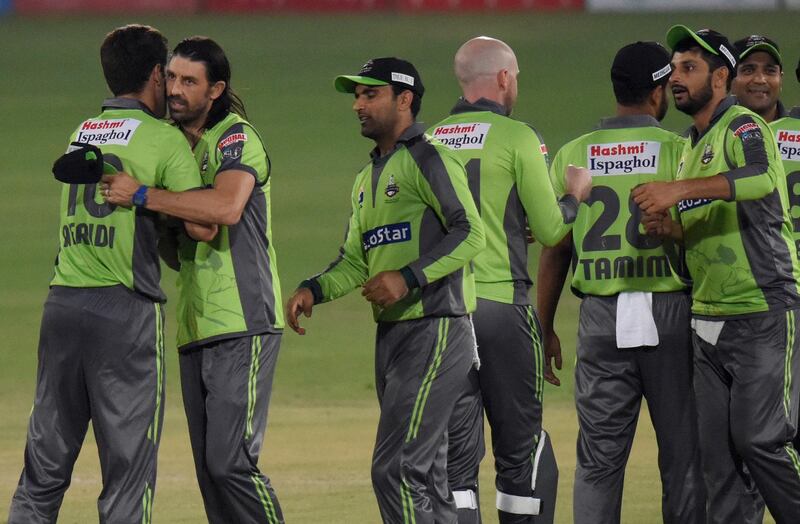 Lahore Qalandars' David Wiese, second left, congratulates teammates after they beat Multan Sultans during the second PSL qualifier at National Stadium in Karachi on Sunday. AP