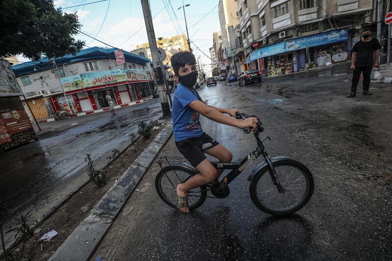 A Palestinian boy wears a protective mask amid the ongoing Covid-19 pandemic in Gaza City, Gaza Strip.  EPA