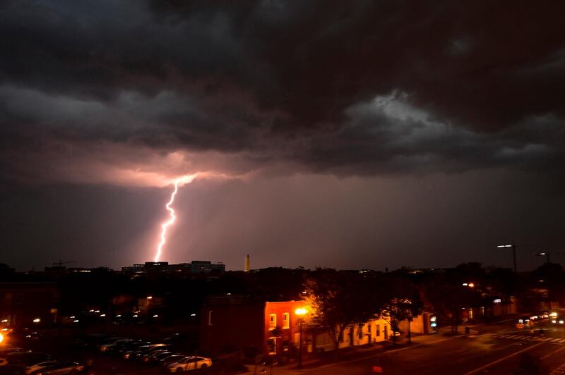 Lightning strikes above Washington, DC. The storm delayed a baseball game between the Washington Nationals and the Cincinnati Reds. Reuters