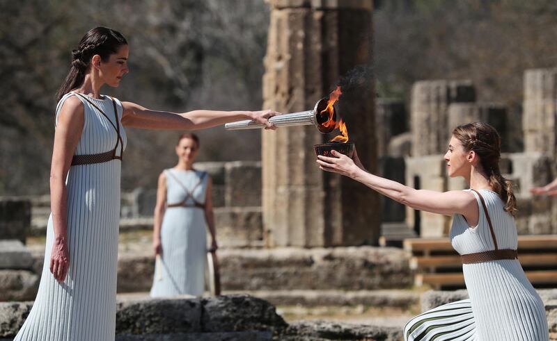 Greek actress Xanthi Georgiou, playing the role of High Priestess, lights the flame during the Olympic flame lighting ceremony. Reuters