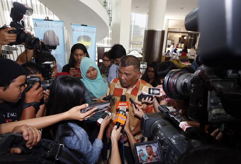 Zamani Zakaria, 56, the father of a passenger on the missing Malaysia Airlines MH370 plane, speaks to journalists at a hotel in Putrajaya, Malaysia. Edgar Su / Reuters March 12