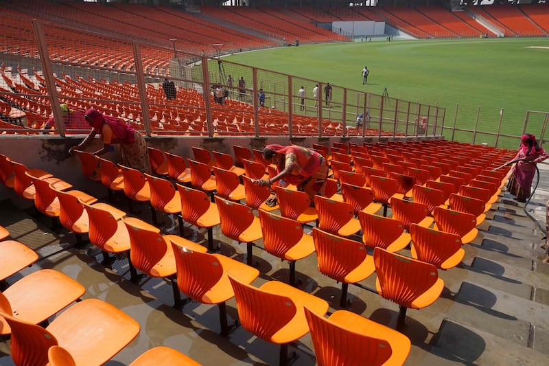Workers clean the Sardar Patel Stadium, the world's biggest cricket stadium. AFP