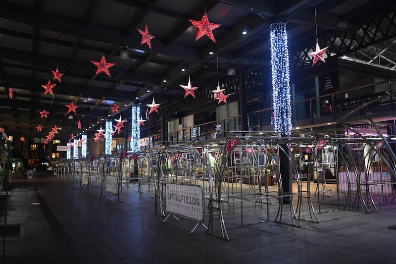 Christmas decorations adorn an empty Spitalfields market in London. Getty Images