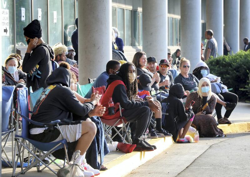 FRANKFORT, KY - JUNE 19: Hundreds of unemployed Kentucky residents wait in long lines outside the Kentucky Career Center for help with their unemployment claims on June 19, 2020 in Frankfort, Kentucky.   John Sommers II/Getty Images/AFP