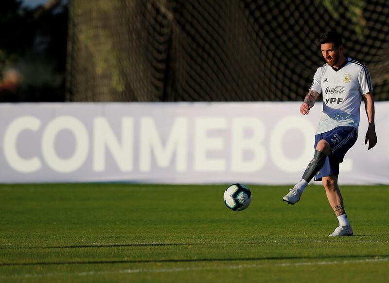 Lionel Messi kicks a ball during training ahead of the Brazil match. Reuters