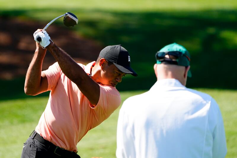 Tiger Woods hits on the driving range while practicing at Augusta National Golf Club. AP