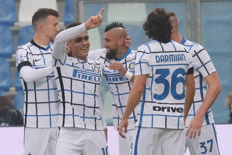 Inter players celebrate after Vlad Chiriches' own goal. EPA