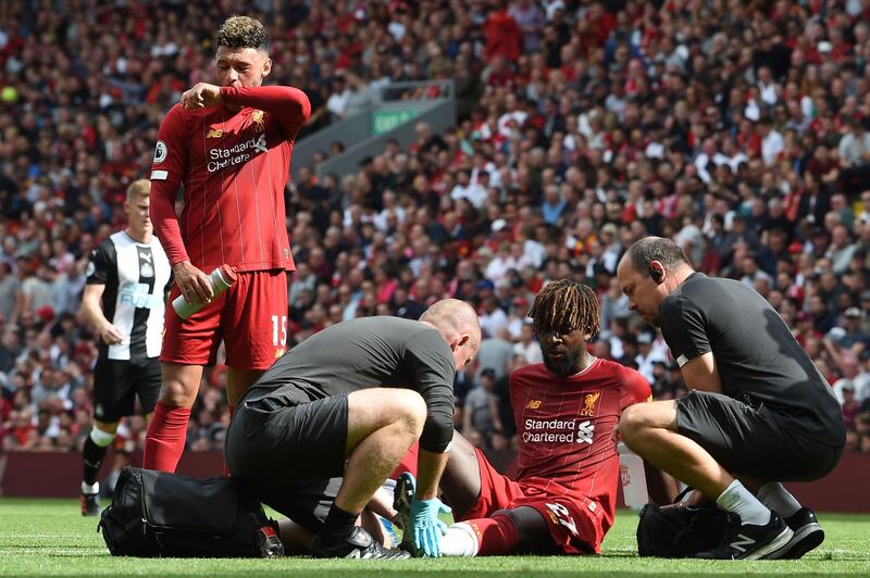 Liverpool's Belgium striker Divock Origi receives medical attention. AFP