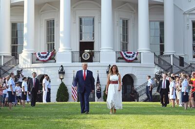 US President Donald Trump and First Lady Melania Trump arrive for the 2020 "Salute to America" event in honor of Independence Day on the South Lawn of the White House in Washington, DC, July 4, 2020. / AFP / SAUL LOEB
