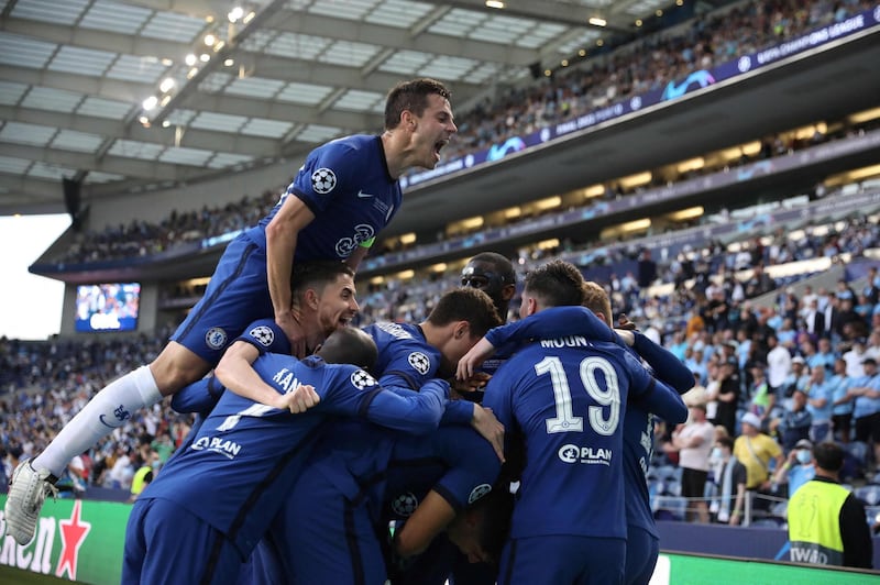 Chelsea's Kai Havertz is mobbed by teammates after scoring.