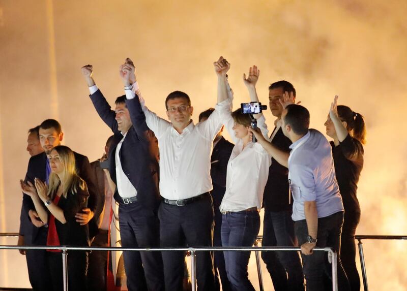 Ekrem Imamoglu greets supporters at a rally of in the Beylikduzu district. Kemal Aslan / Reuters