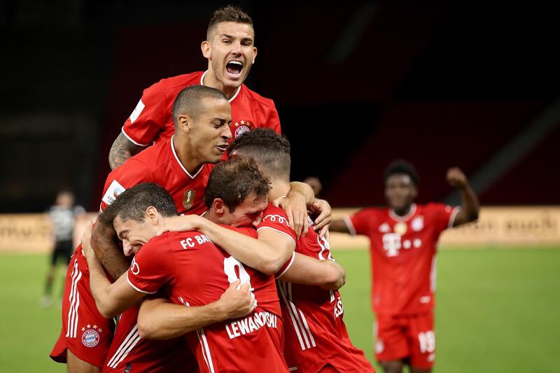 Lewandowski (L-bottom) of Bayern Munich celebrates scoring. EPA