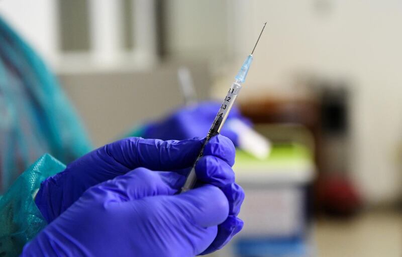 A healthcare worker holds a syringe with the Pfizer-BioNTech COVID-19 vaccine at the University Hospital in Nitra, Slovakia. Reuters