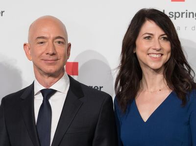 (FILES) In this file photo taken on April 24, 2018 Amazon CEO Jeff Bezos and his wife MacKenzie Bezos  poses as they arrive at the headquarters of publisher Axel-Springer where he will receive the Axel Springer Award 2018 in Berlin. Amazon founder Jeff Bezos, rated the world's wealthiest person, announced on January 9, 2019 on Twitter that he and his wife Mackenzie Bezos were divorcing after a long separation. "We want to make people aware of a development in our lives," Jeff Bezos, 54, and MacKenzie Bezos, 48, said in joint statement posted to Bezos' Twitter feed.
 / AFP / dpa / JORG CARSTENSEN
