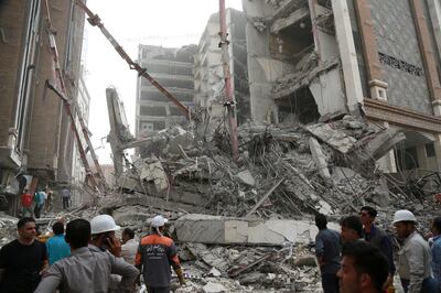 Rescue crews search for survivors following the building collapse. Reuters