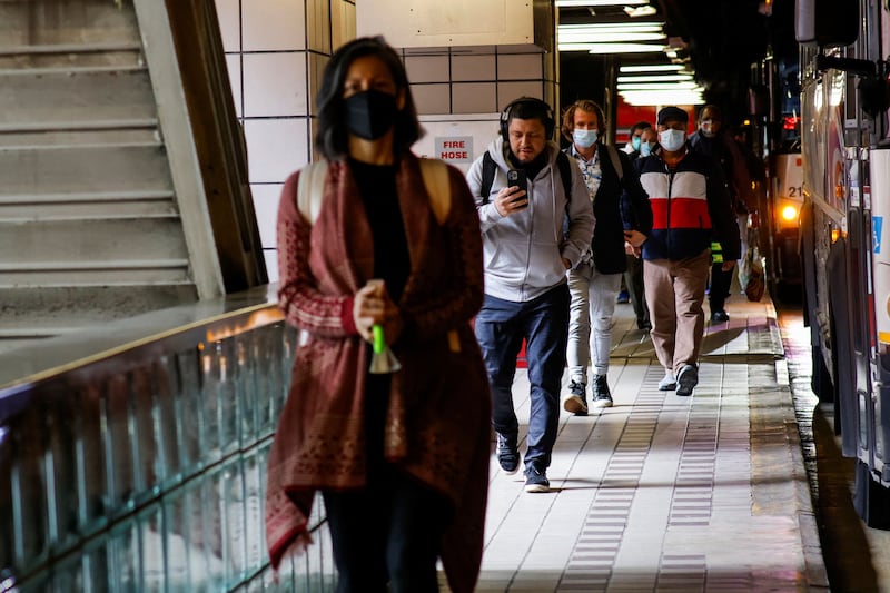 People arrive at a New Jersey transit station after the nationwide public transport mask mandate is repealed. Reuters