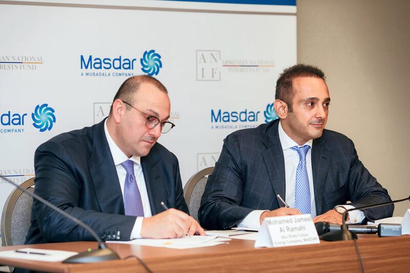 Mohamed Jameel Al Ramahi, chief executive of Masdar, and David Papazian, chief executive of the Armenian National Interests Fund (ANIF), sign a preliminary agreement to explore collaboration in renewable energy. Courtesy Masdar