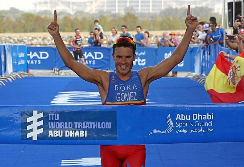 Javier Gomez celebrates as he crosses the finish line first to win the ITU World Triathlon Abu Dhabi on Saturday. Nezar Balout / AFP

