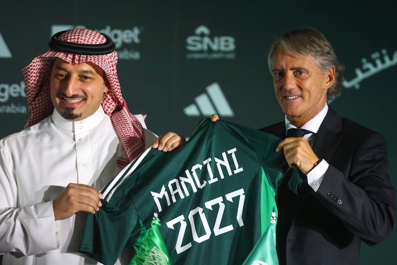 The president of the Saudi Arabian Football Federation, Yasser al-Misehal, left, and newly-appointed Italian coach of the Saudi Arabia national football team, Roberto Mancini. AFP