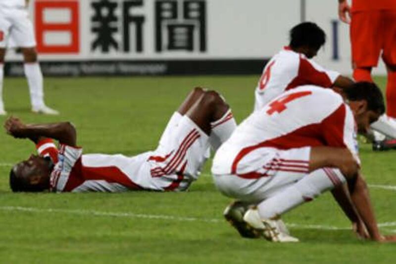 DUBAI, UNITED ARAB EMIRATES Ð Nov 19: Dejected UAE players after the draw of World Cup qualifier football match between UAE vs Iran at Al NasrÕs Al Maktoum Stadium in Dubai. (Pawan Singh / The National)
