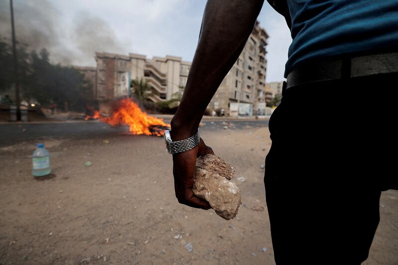 A supporter of Senegal opposition leader Ousmane Sonko during clashes ahead of his leader's court appearance for a libel case in Dakar. Reuters

