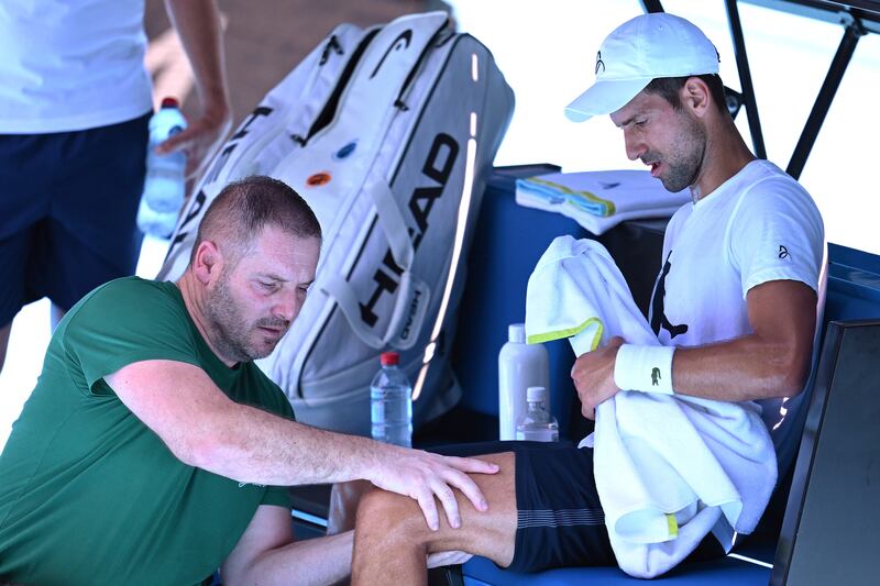 Novak Djokovic receives treatment during an Australian Open practice session at Melbourne Park on Wednesday, January 11, 2023. EPA