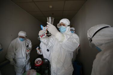 Workers prepare to disinfect rooms at the Red Cross hospital in Wuhan, in China's central Hubei province earlier in the week. AFP