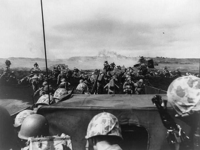 A wave of US marines from the Fourth Division storms Iwo Jima as another boat full of servicemen approaches on February 19, 1945. Reuters