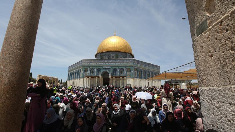 epa07561073 Palestinian worshipers pray outside of the Dome of the Rock at the al-Aqsa mosque compound, during the first Friday prayers of the Muslims' Holy month of Ramadan in Jerusalem, 10 May 2019. Israeli authorities allowed access to Jerusalem for women and children, limiting the age of men to those over 40. Muslims around the world celebrate the holy month of Ramadan by praying during the night time and abstaining from eating, drinking, and sexual acts daily between sunrise and sunset. Ramadan is the ninth month in the Islamic calendar and it is believed that the Koran's first verse was revealed during its last 10 nights.  EPA/ALAA BADARNEH