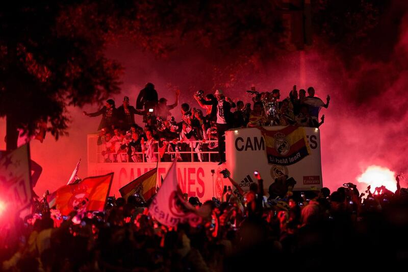 Real Madrid players arrive at Cibeles Square in Madrid to celebrate their Champions League victory with fans on Saturday night. Gonzalo Arroyo Moreno / Getty Images / May 24, 2014