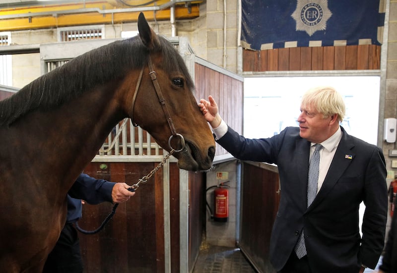 Mr Johnson meets Vimala, a police horse, during a visit to a Metropolitan Police station in London. AFP