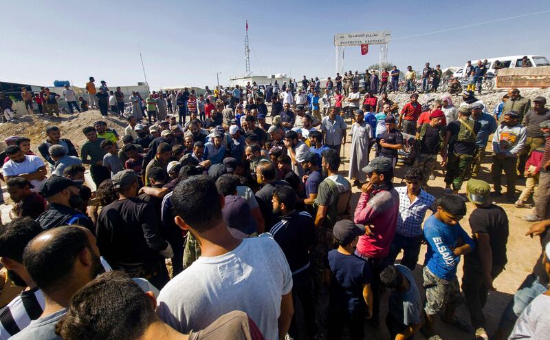 Mourners at the funeral and burial of fighters from the Hamza Division Syrian rebel group who were killed in the air raids. AFP