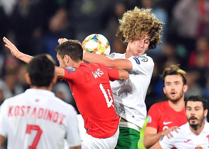 Bozhidar Kraev of Bulgaria fights for ball with Harry Winks during their Euro 2020 Qualifying Group A match. EPA