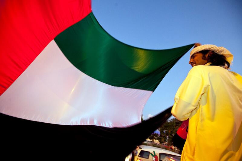 People join in celebration and show off their decorated cars during the Spirit of Union Parade on Thursday evening, Dec. 1, 2011, at the Yas Island near Abu Dhabi. (Silvia Razgova/The National)
