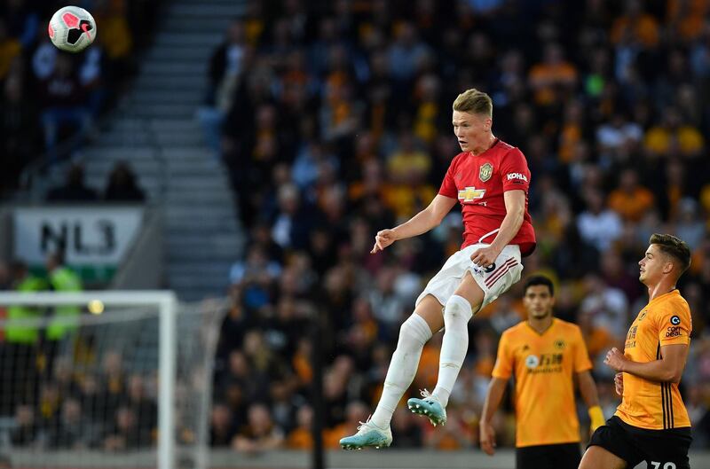 Manchester United midfielder Scott McTominay jumps to head the ball. AFP