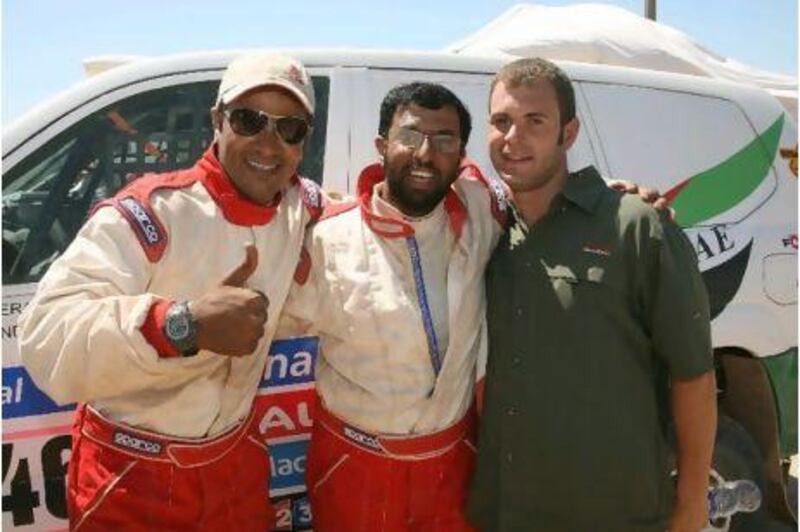 Abdullah al Huraiz, centre, with his co-driver Khalid Ahmad Bilal Abdulla, left, hopes to secure outside funding to run the Dakar again next year.