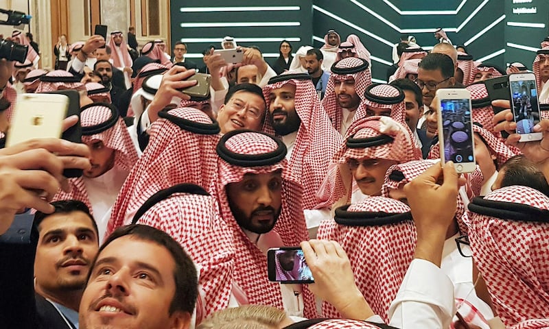 FILE PHOTO: Saudi Arabia's Crown Prince Mohammed bin Salman poses for a selfie during the Future Investment Conference in Riyadh, Saudi Arabia. October 23, 2018./File Photo