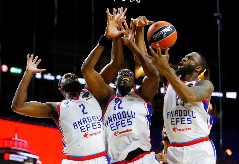 Anadolu Efes Istanbul's Bryant Dunston, Chris Singleton and James Anderson in the Euroleague Final against FC Barcelona at the Lanxess Arena in Cologne, on Sunday May 30. Reuters